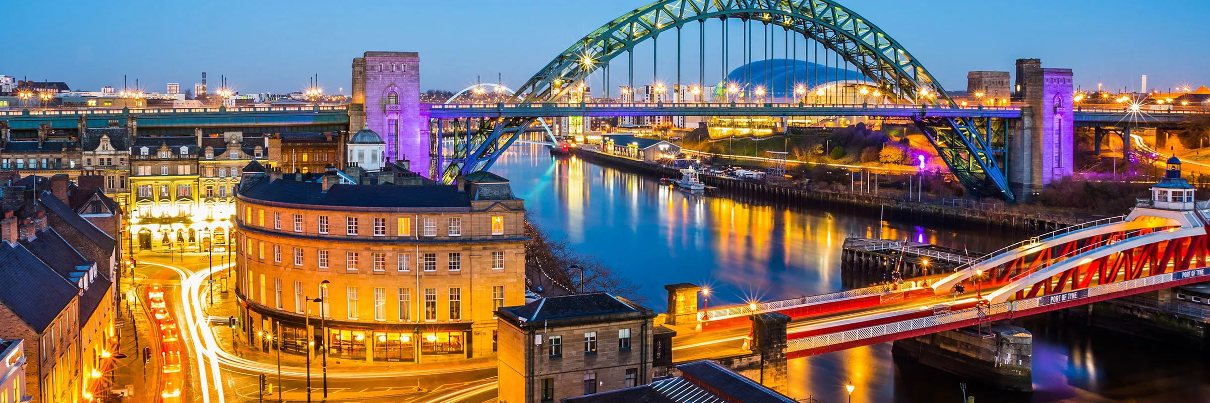 The Tyne Bridge and the Quayside lit up at night, Newcastle