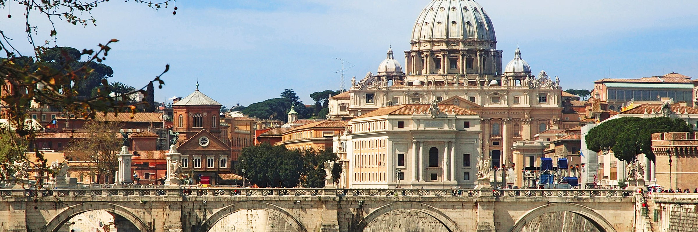 The dome of St Peter's basilica and the Ponte Sant'Angelo in Rome