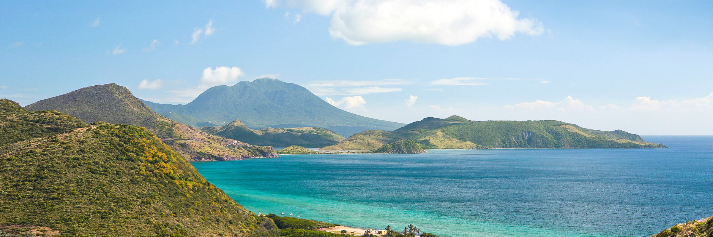 A green tropical coastline seen from the water, Saint Kitts