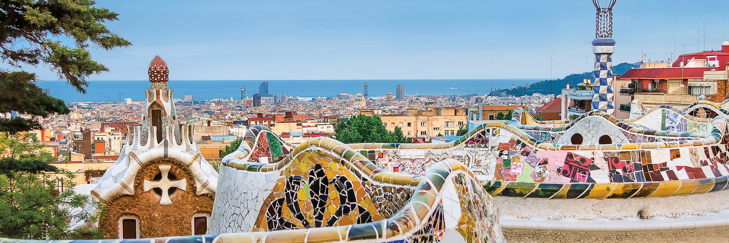 Trencadís mosaic benches at Park Güell looking out over Barcelona